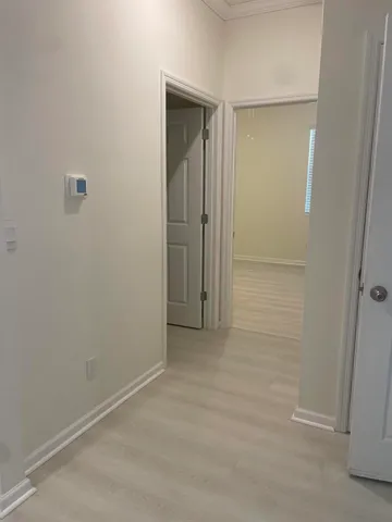 a bathroom with a sink a mirror and a window