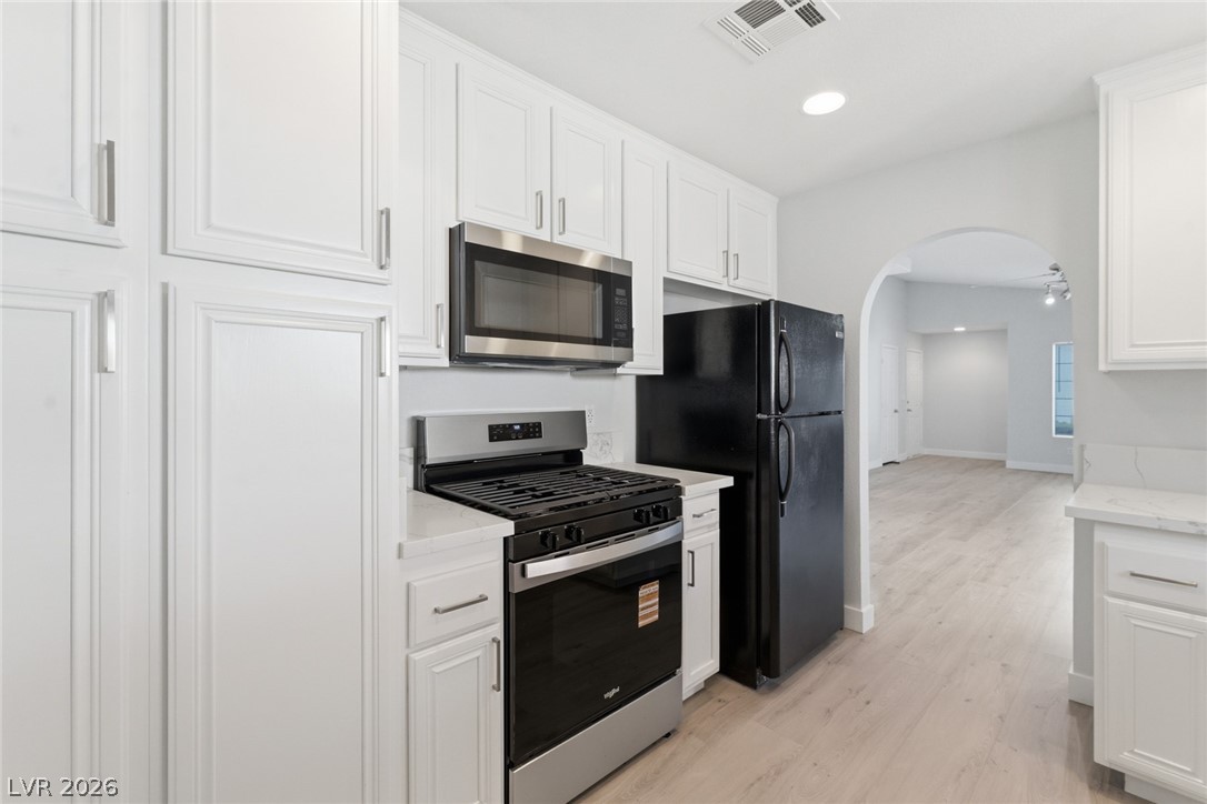 5449 Bugle Way, Unit 104 Las Vegas, NV 89108 - Photo 11 of 33 This bright kitchen features new appliances and ample cabinetry, offering both style and function.