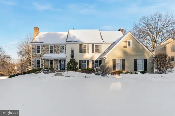 a front view of a house with a covered with snow in front of house
