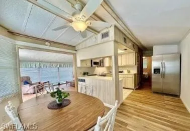 a kitchen with stainless steel appliances granite countertop a sink and cabinets