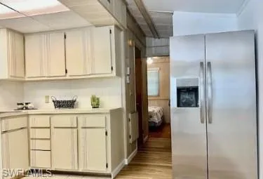 a kitchen with white cabinets