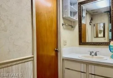 a bathroom with a sink and a mirror