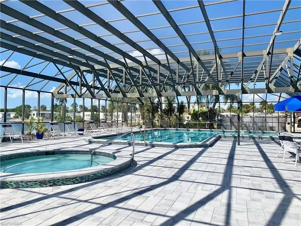 a view of a swimming pool with a patio