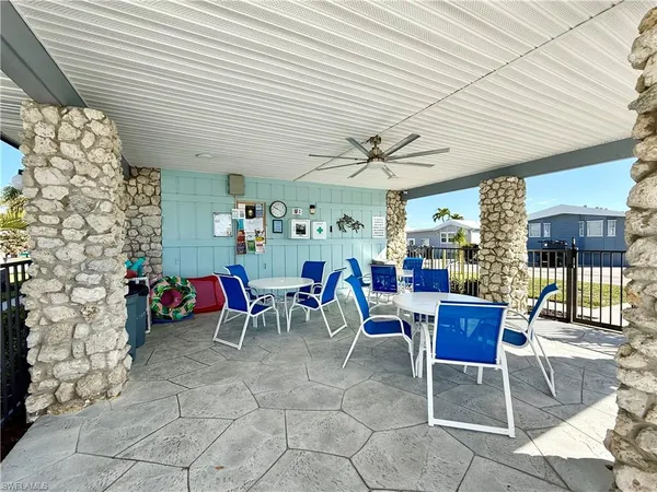 a view of a swimming pool and lounge chairs