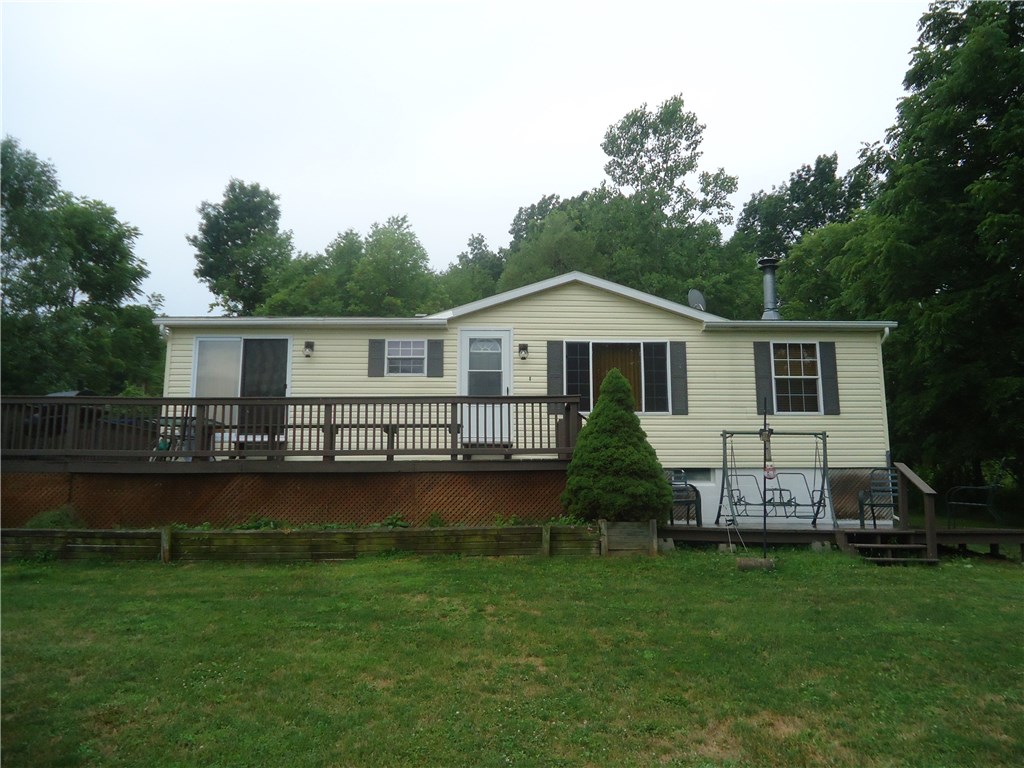 5546 Clark Road Conesus, NY 14435 - Photo 1 of 1 Front view of the home w wrap around deck. Lower d