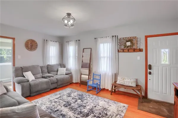 a living room with furniture and a rug