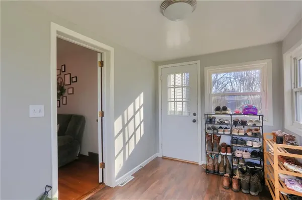 a view of a livingroom with furniture and closet