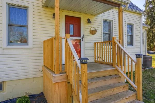 a view of a house with wooden floor and fence