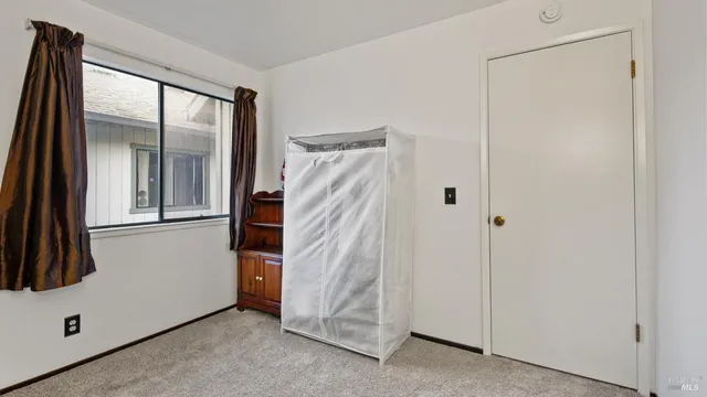 a view of a walk in closet and bedroom view
