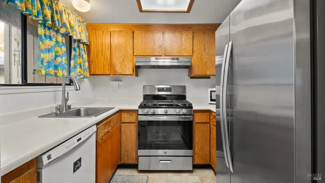 a kitchen with a stove and a sink