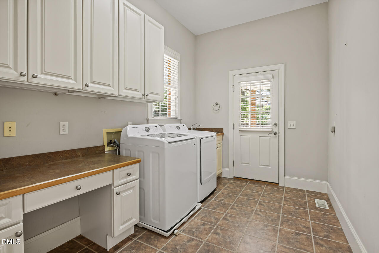 4004 Frontenac Court Apex, NC 27539 - Photo 25 of 61 a utility room with sink dryer and washer