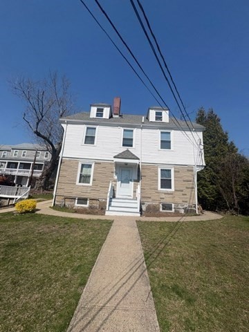 a view of a house with a yard