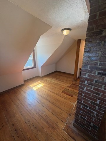 5 Oakland Street Boston, MA 02119 - Photo 19 of 21 a view of empty room with wooden floor