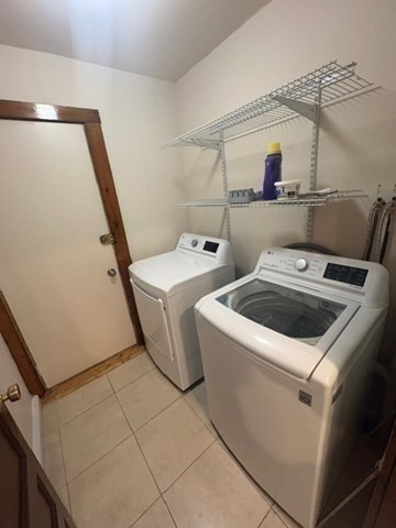 5 Oakland Street Boston, MA 02119 - Photo 6 of 21 a utility room with dryer and washer