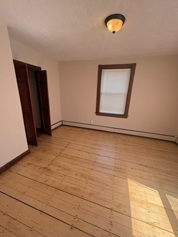 5 Oakland Street Boston, MA 02119 - Photo 7 of 21 a view of an empty room with a window