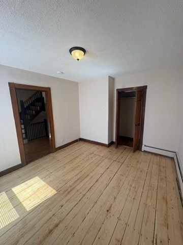 5 Oakland Street Boston, MA 02119 - Photo 8 of 21 a view of empty room with wooden floor
