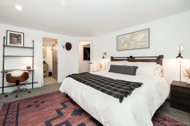 a living room with a bed furniture and a window