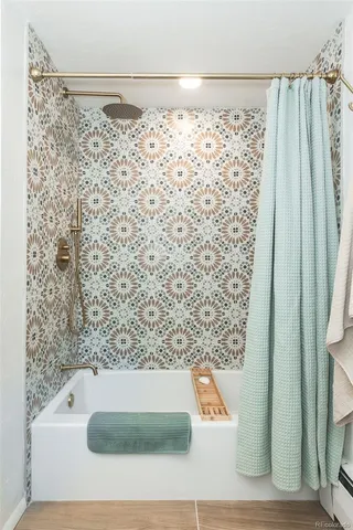 a bathroom with a sink toilet and mirror