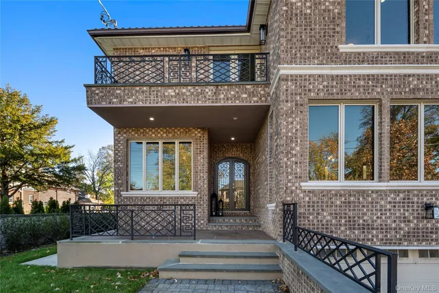a front view of a house with a garden