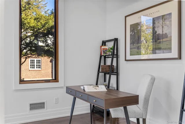 a view of a room that has a table and chairs in it