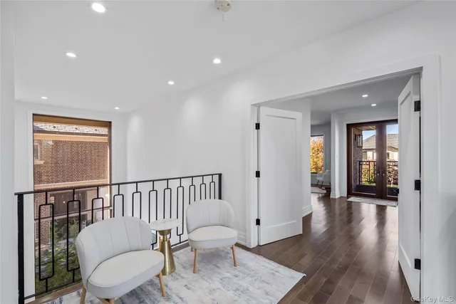 a balcony with furniture and wooden floor