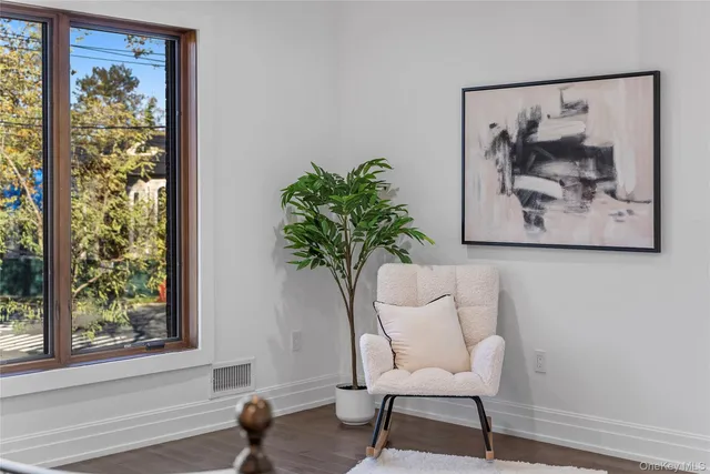 a view of a workspace with furniture and a potted plant
