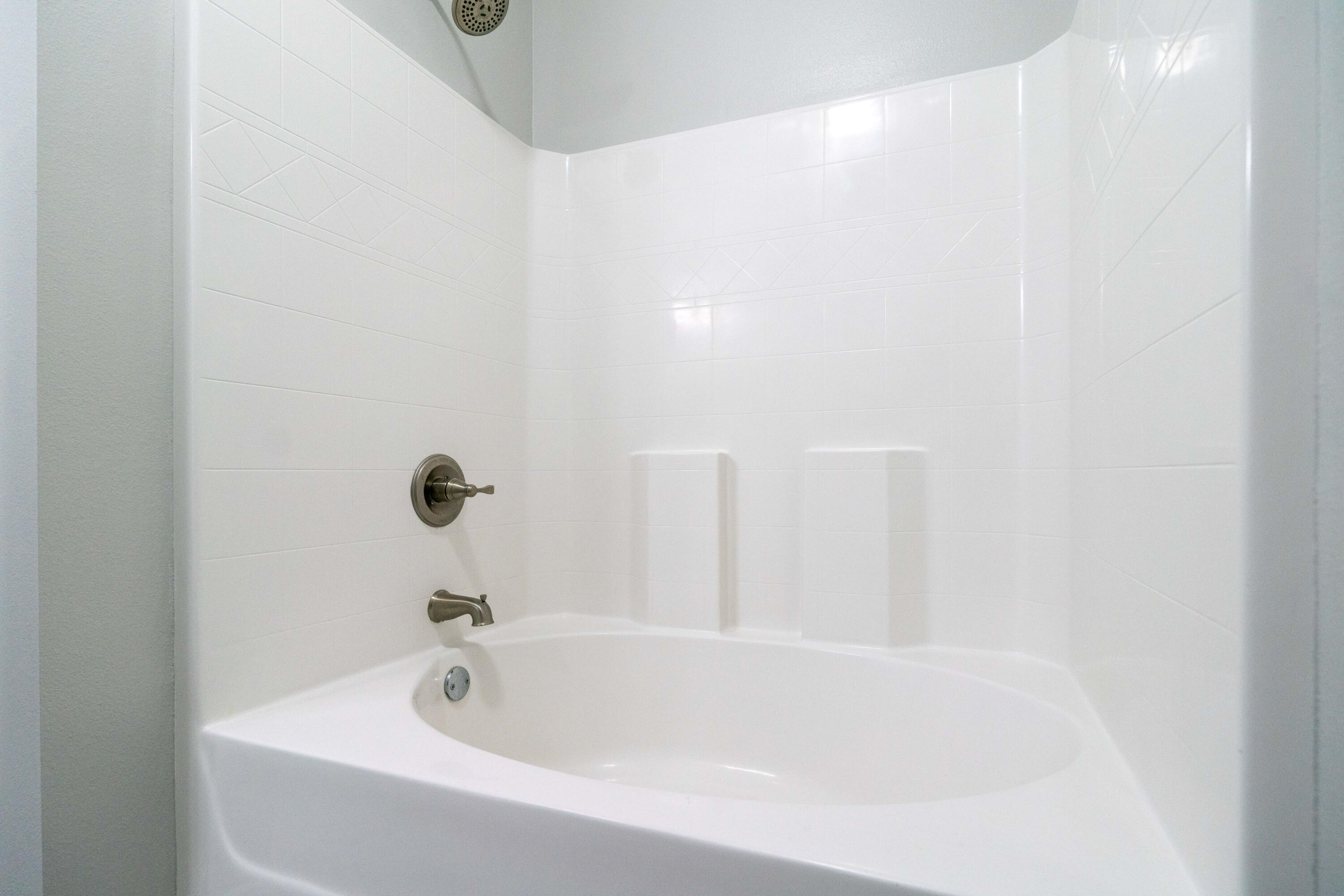 2243 Wind Trace Road North Navarre, FL 32566 - Photo 17 of 34 a bathroom with a tub