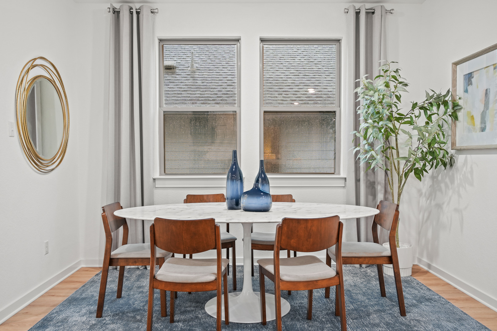 180 Hornet Street Elgin, TX 78621 - Photo 10 of 39 a dining room with furniture and a potted plant