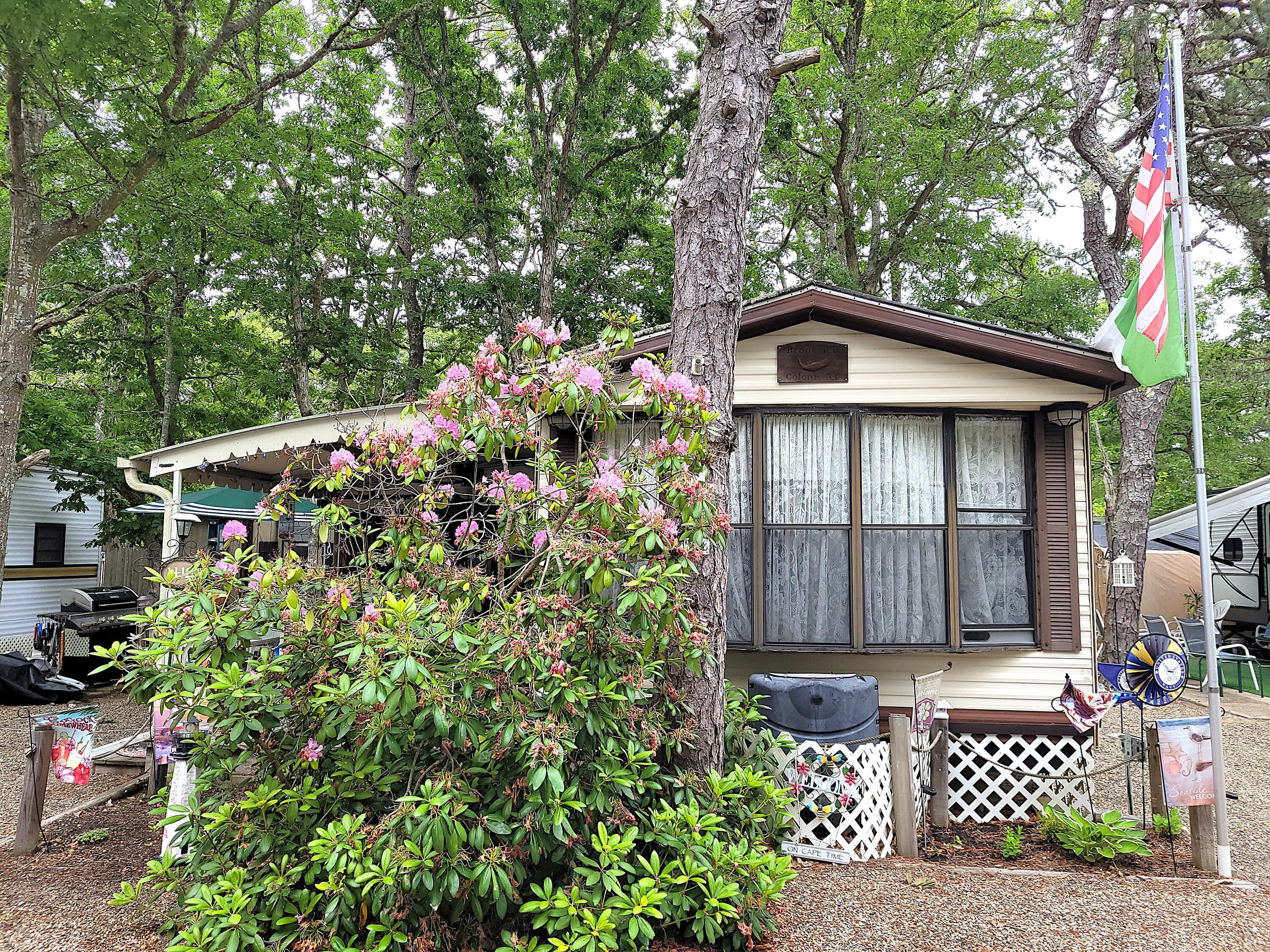 310 Old Chatham Road, Unit H12 South Dennis, MA 02660 - Photo 12 of 55 a front view of a house with garden