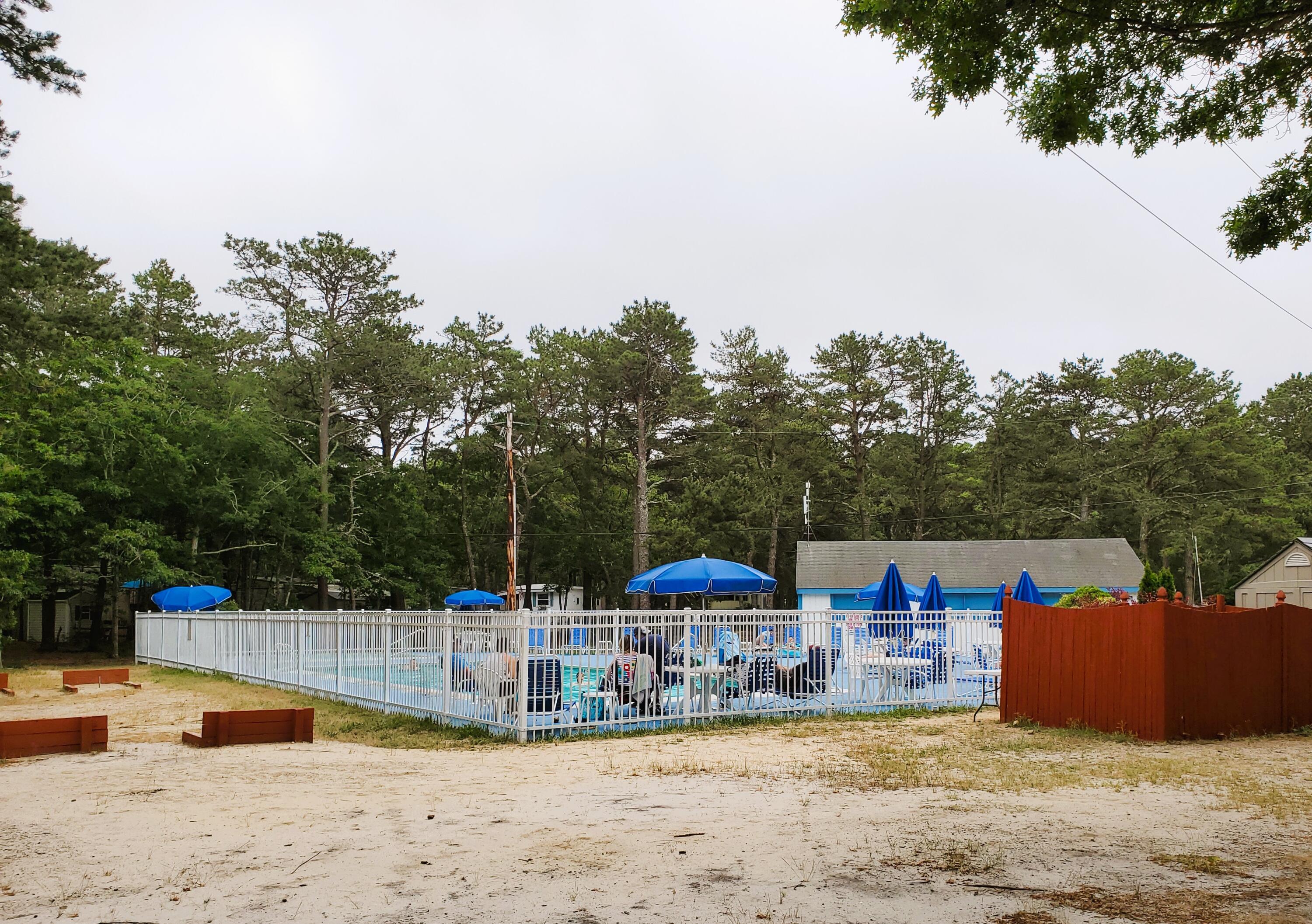 310 Old Chatham Road, Unit H12 South Dennis, MA 02660 - Photo 17 of 55 a view of a terrace with chairs