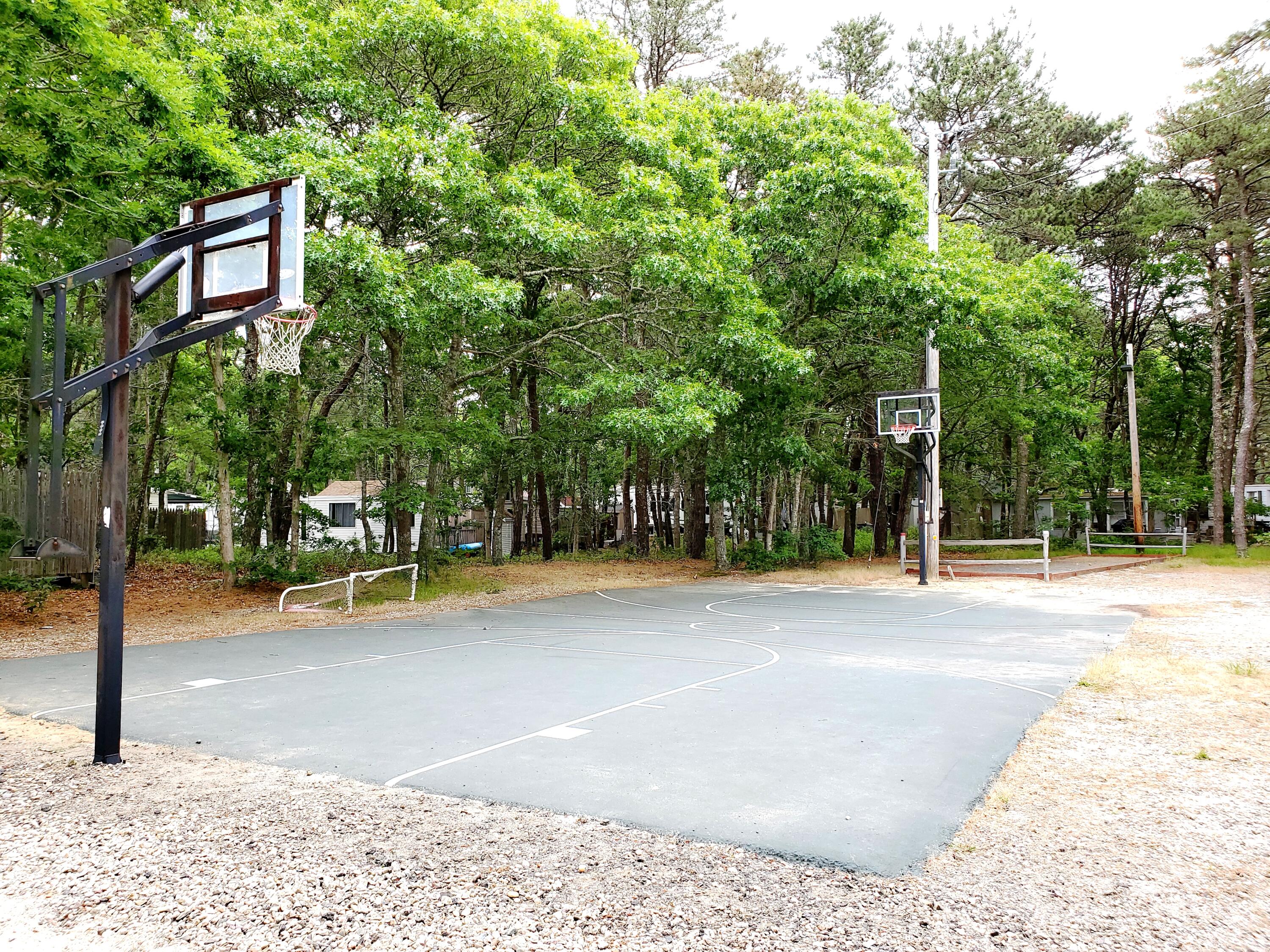 310 Old Chatham Road, Unit H12 South Dennis, MA 02660 - Photo 20 of 55 a view of a swimming pool with an outdoor space and seating area