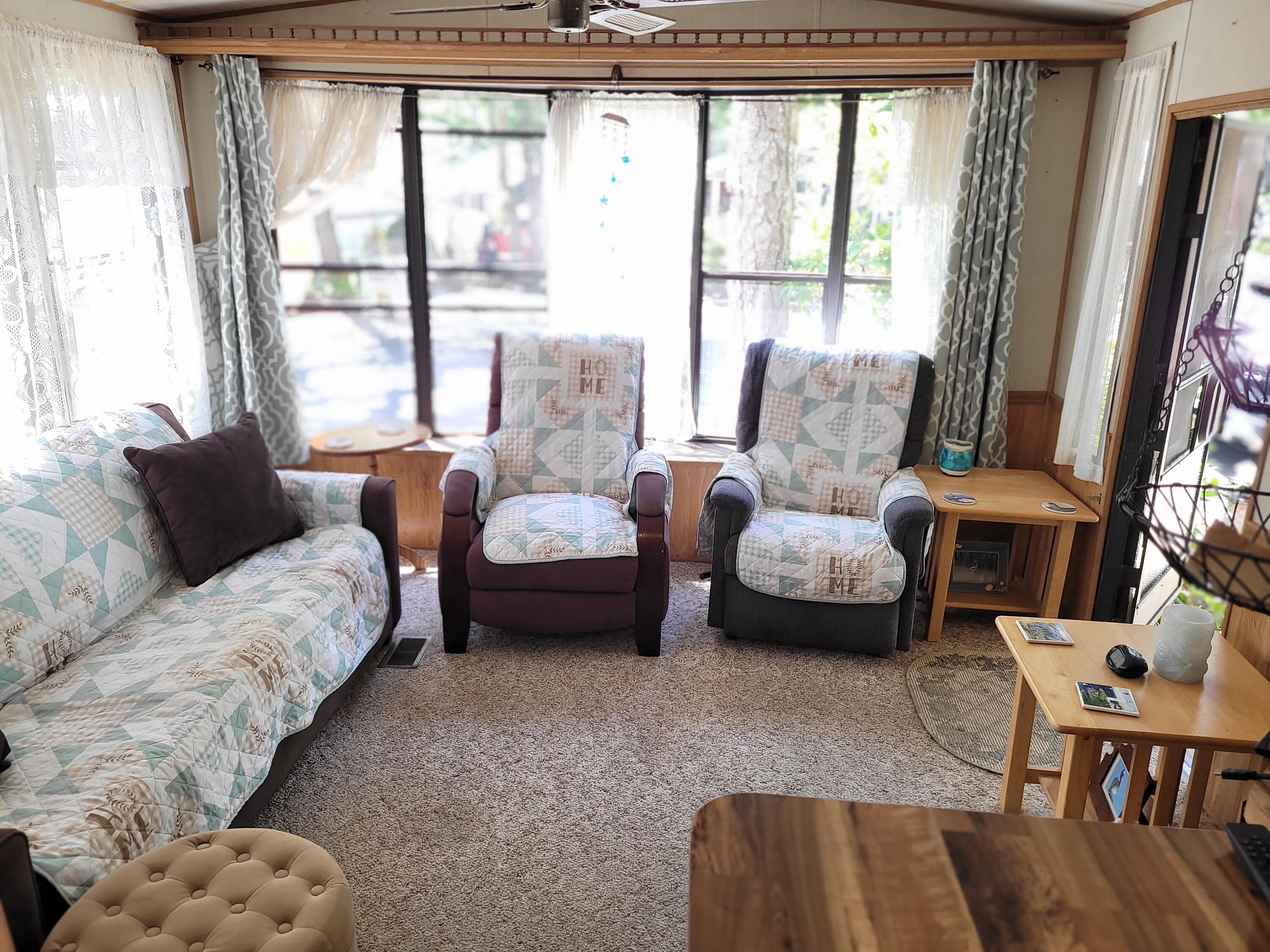 310 Old Chatham Road, Unit H12 South Dennis, MA 02660 - Photo 28 of 55 a living room with furniture and a large window