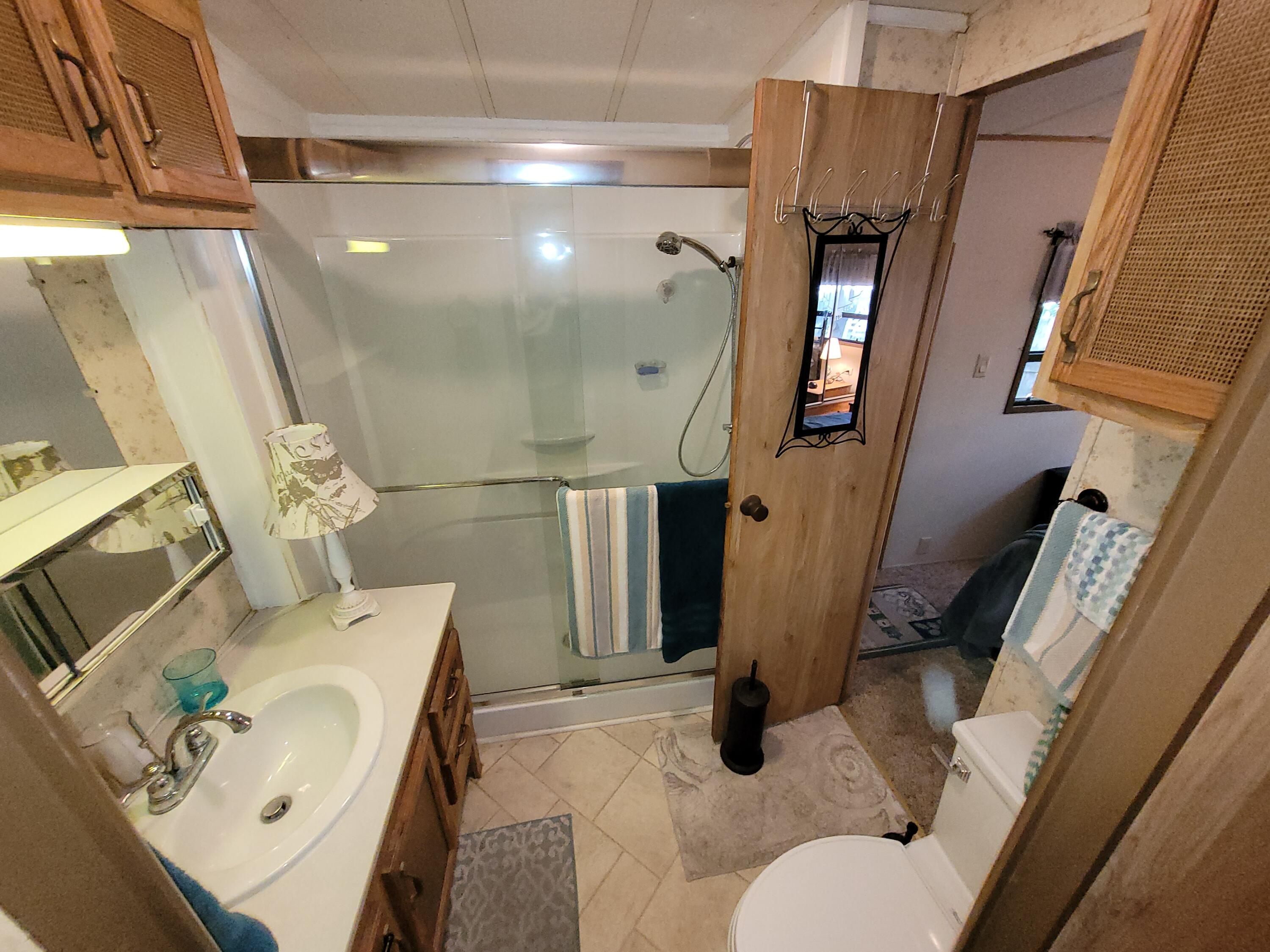 310 Old Chatham Road, Unit H12 South Dennis, MA 02660 - Photo 32 of 55 a bathroom with a sink toilet and shower
