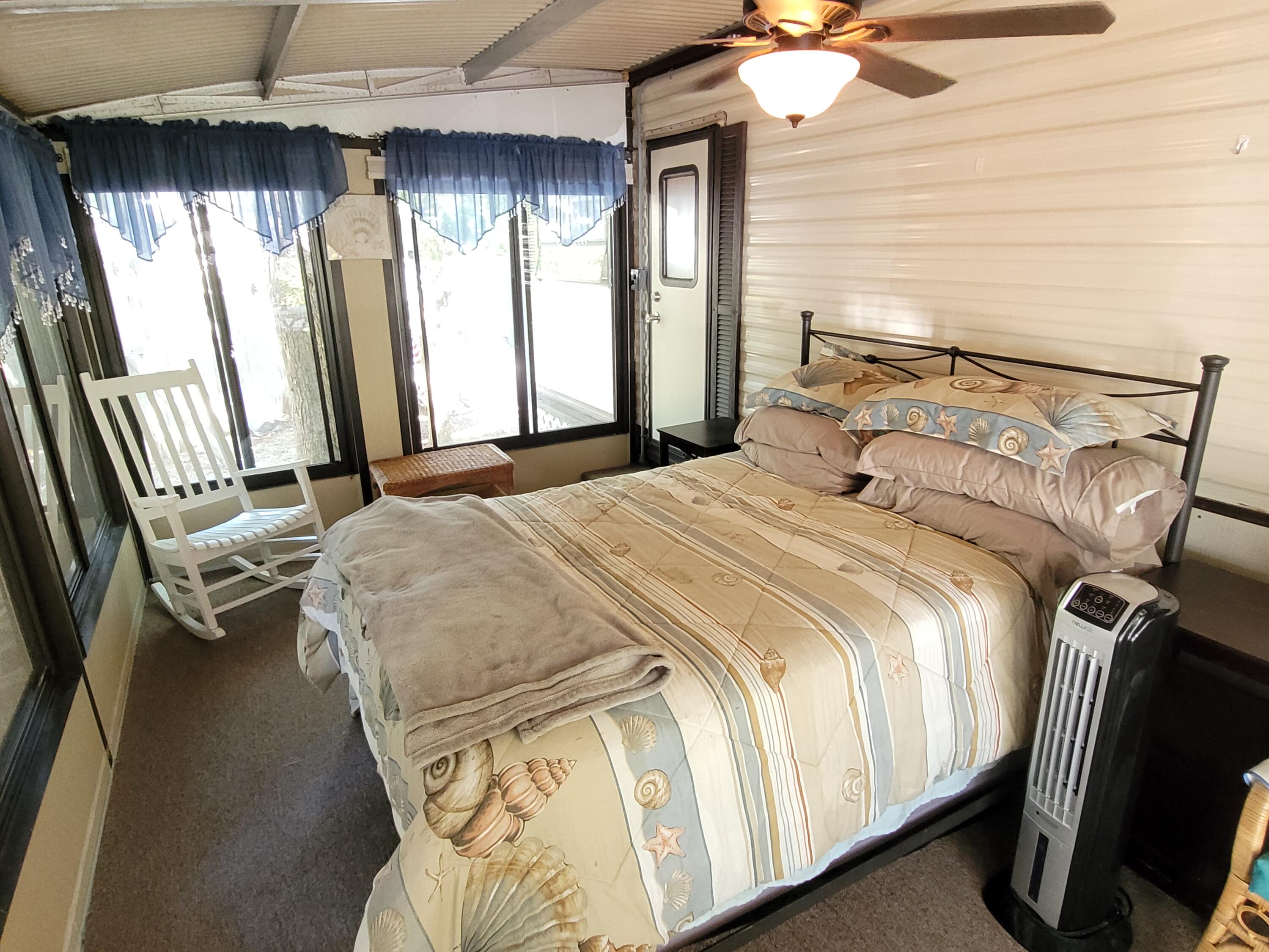 310 Old Chatham Road, Unit H12 South Dennis, MA 02660 - Photo 53 of 55 a bedroom with a bed and a window