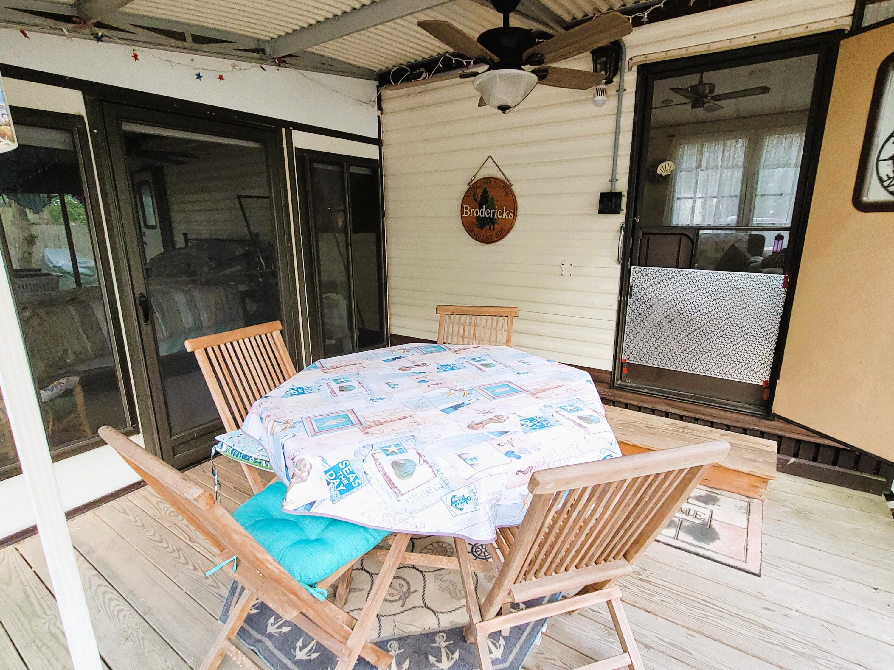 310 Old Chatham Road, Unit H12 South Dennis, MA 02660 - Photo 8 of 55 a view of a dining room with a table and chairs
