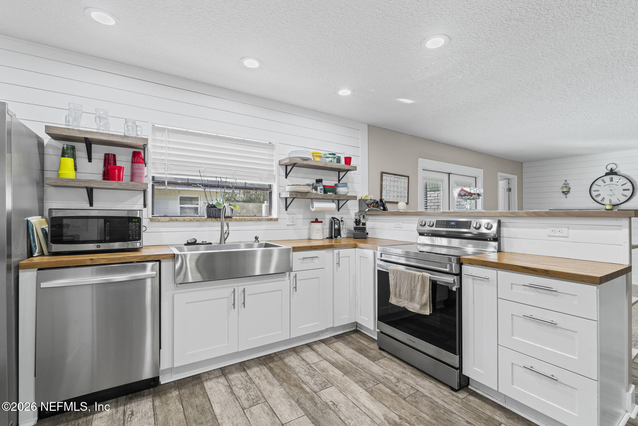 3084 Joe Johns Road Middleburg, FL 32068 - Photo 13 of 52 a kitchen with cabinets a sink and appliances
