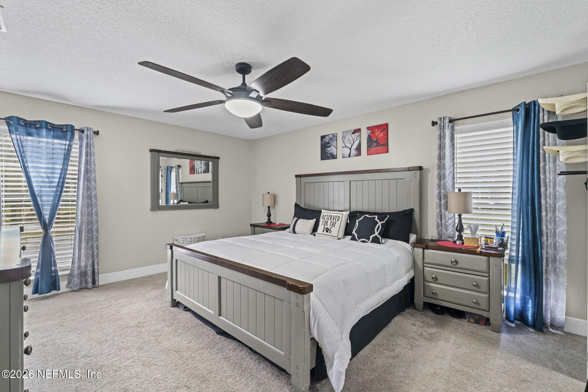 3084 Joe Johns Road Middleburg, FL 32068 - Photo 19 of 52 a bedroom with a bed chandelier and a window