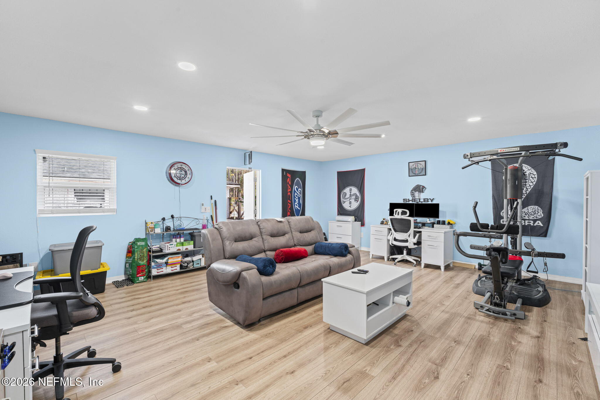 3084 Joe Johns Road Middleburg, FL 32068 - Photo 26 of 52 a living room with furniture kitchen view and a wooden floor