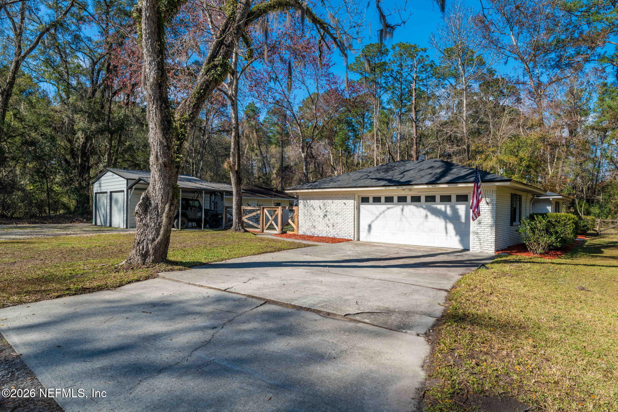 3084 Joe Johns Road Middleburg, FL 32068 - Photo 35 of 52 a view of a street with a building and large trees