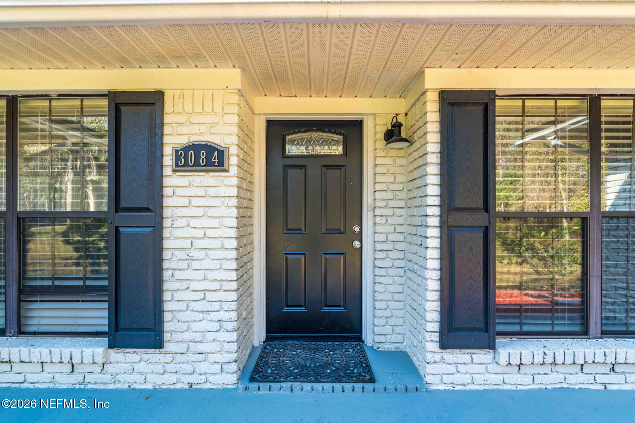 3084 Joe Johns Road Middleburg, FL 32068 - Photo 4 of 52 a front view of a house with a door