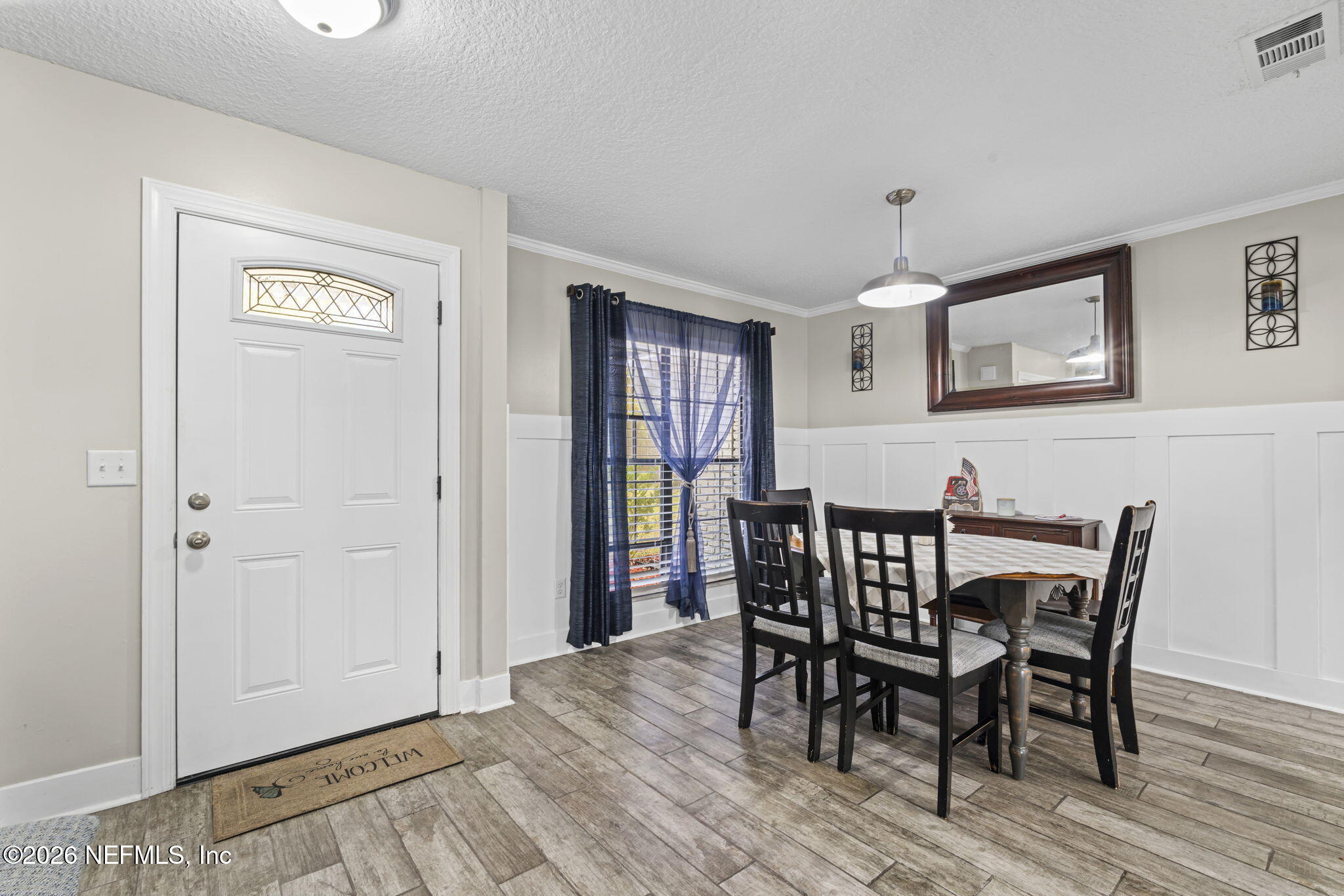 3084 Joe Johns Road Middleburg, FL 32068 - Photo 6 of 52 a view of a dining room with furniture and wooden floor