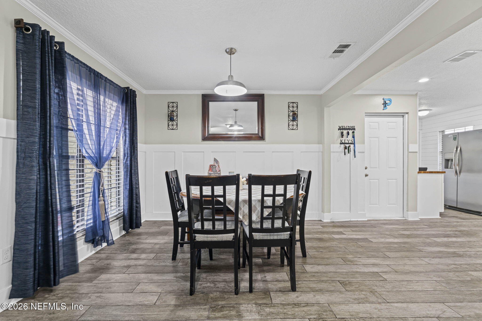 3084 Joe Johns Road Middleburg, FL 32068 - Photo 7 of 52 a view of a dining room with furniture window and wooden floor