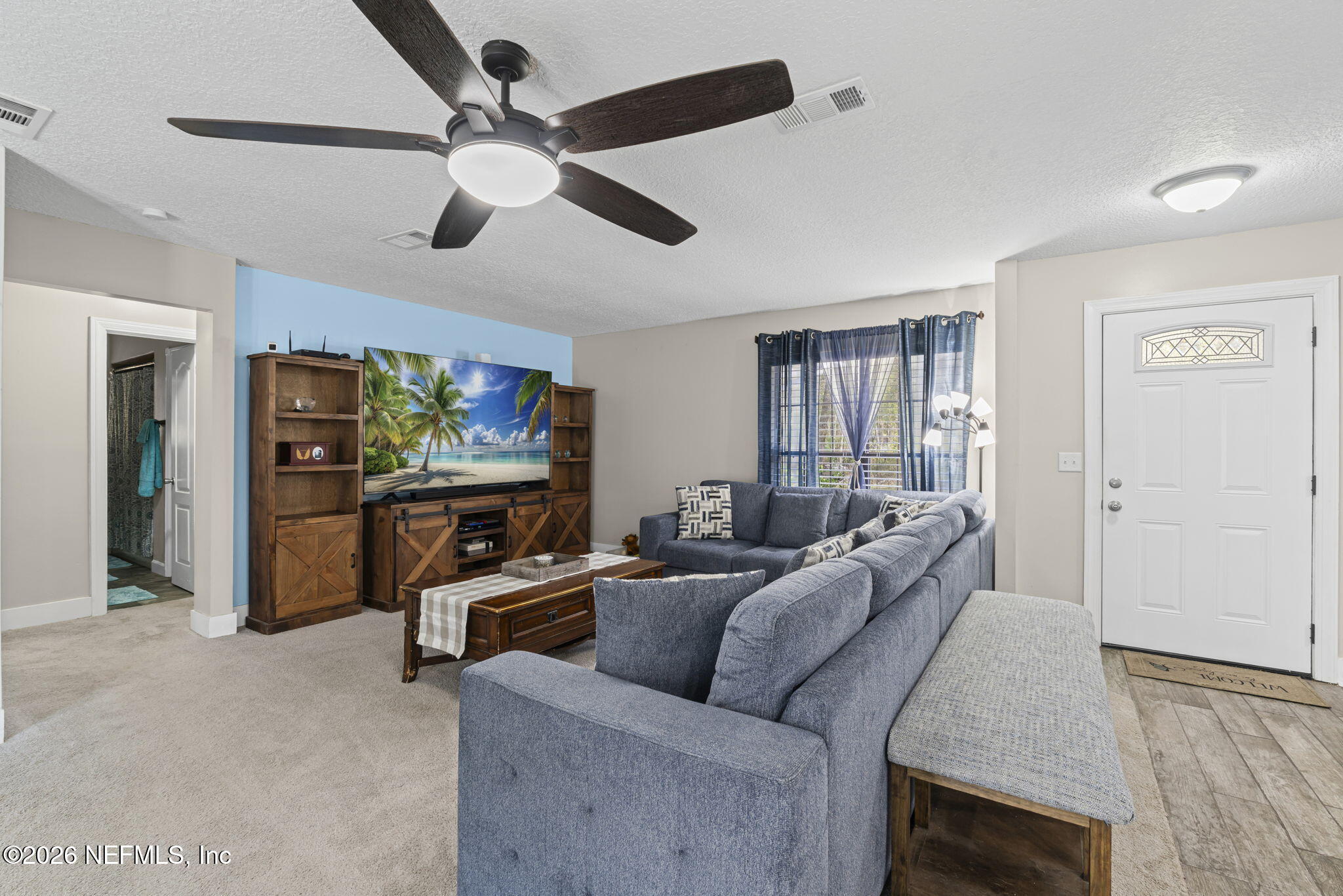 3084 Joe Johns Road Middleburg, FL 32068 - Photo 8 of 52 a living room with furniture and a flat screen tv