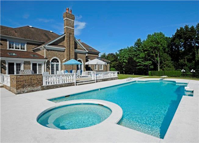 261 Round Hill Road Greenwich, CT 06831 - Photo 1 of 1 a view of a house with swimming pool