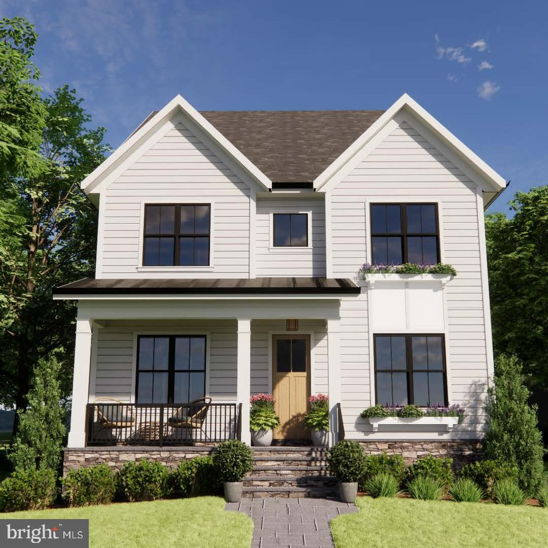 1036 North Daniel Street Arlington, VA 22201 - Photo 2 of 9 a front view of a house with garage and plants