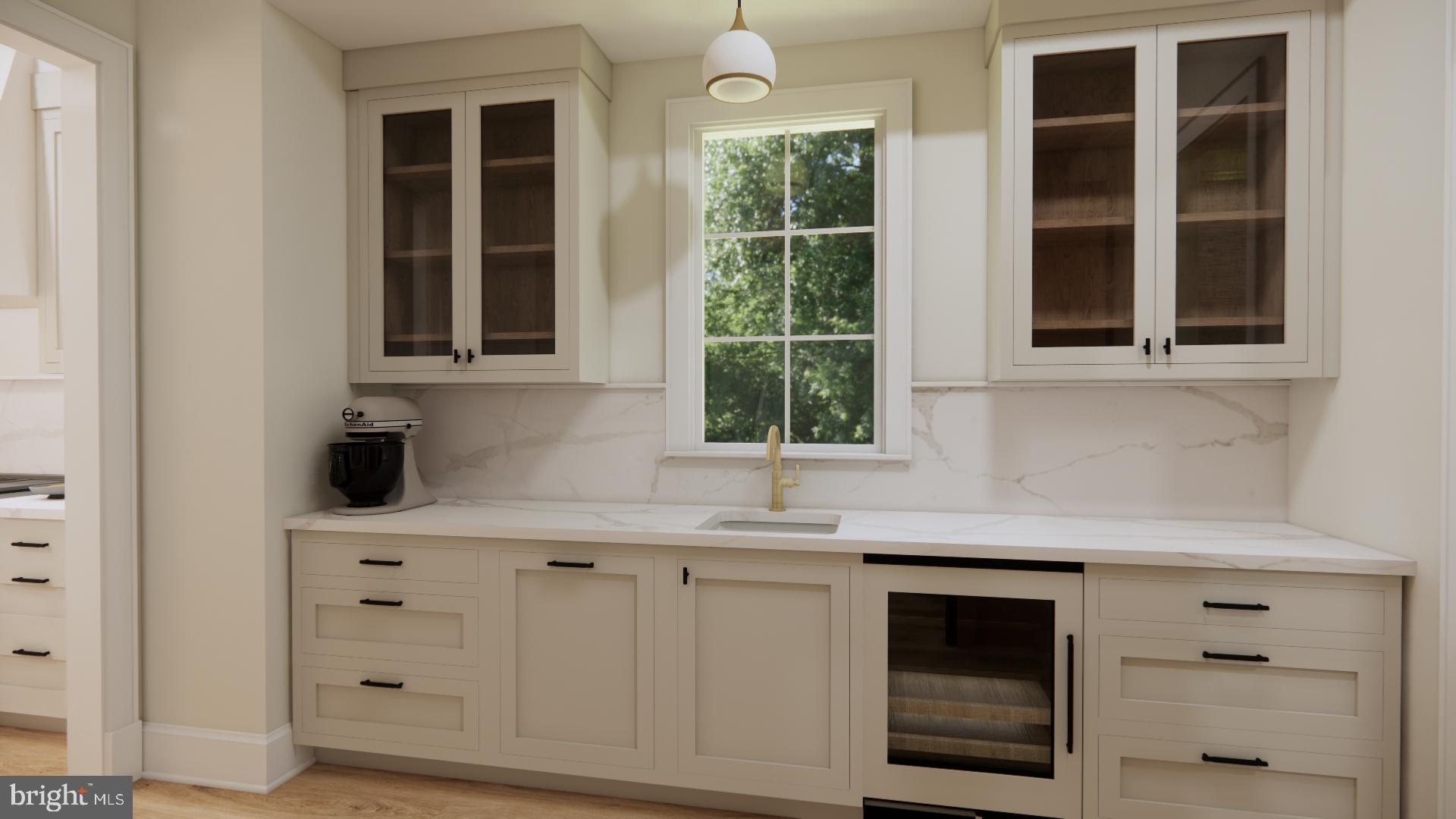 1036 North Daniel Street Arlington, VA 22201 - Photo 4 of 9 a kitchen with white cabinets and window
