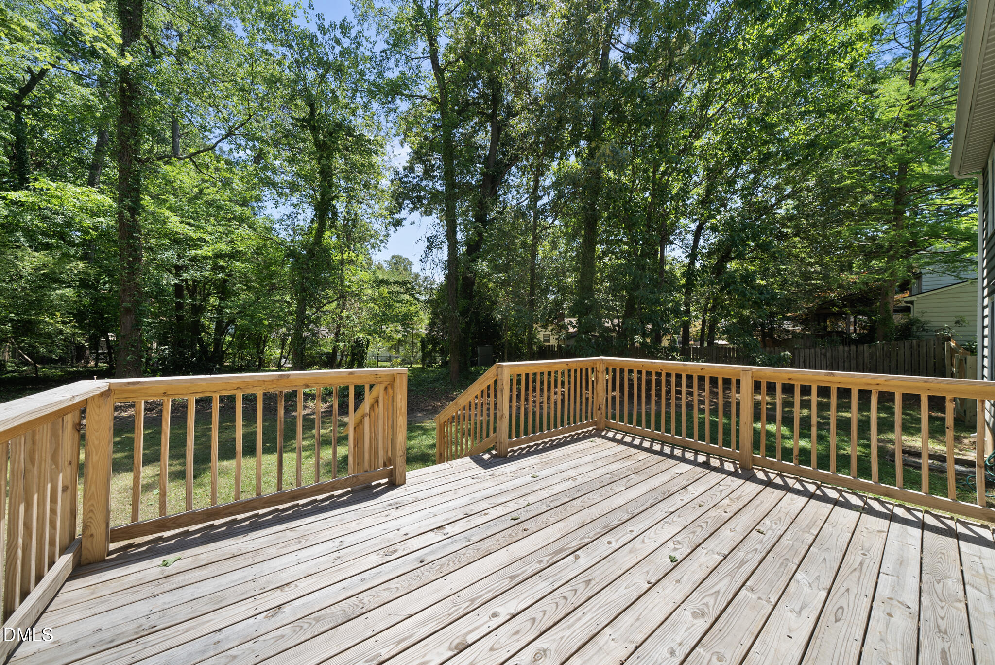 2108 Treverton Place Raleigh, NC 27609 - Photo 20 of 30 a balcony with wooden floor and fence