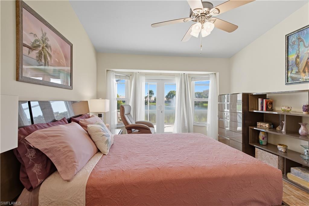 2266 Stacil Circle, Unit 3 Naples, FL 34109 - Photo 31 of 49 Bedroom with access to outside, a water view, french doors, and ceiling fan