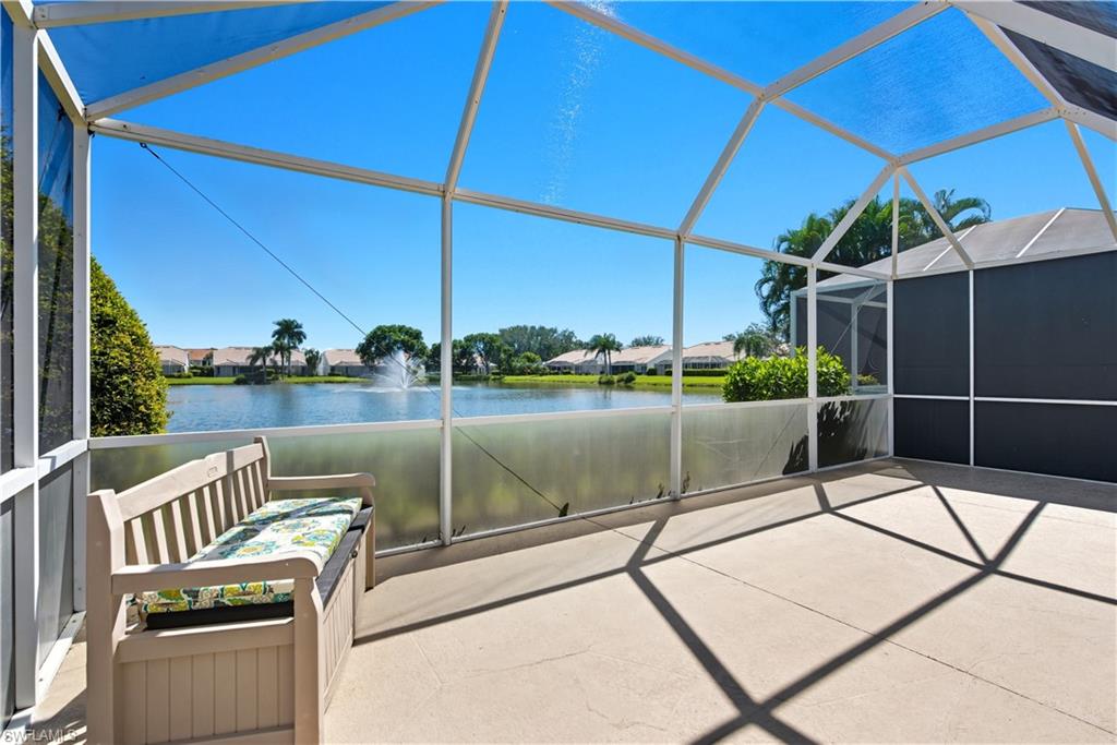 2266 Stacil Circle, Unit 3 Naples, FL 34109 - Photo 36 of 49 View of patio / terrace featuring a sunroom, glass enclosure, a water view, and a residential view