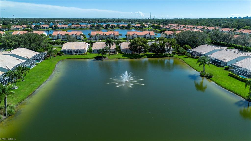 2266 Stacil Circle, Unit 3 Naples, FL 34109 - Photo 45 of 49 Aerial perspective of suburban area with a nearby body of water